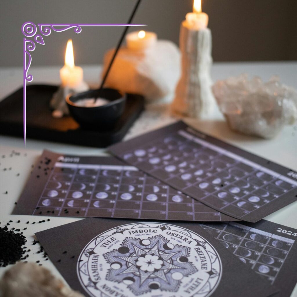 papers with lunar calendars and a wheel of the year, with candles, quartz and incense in the background