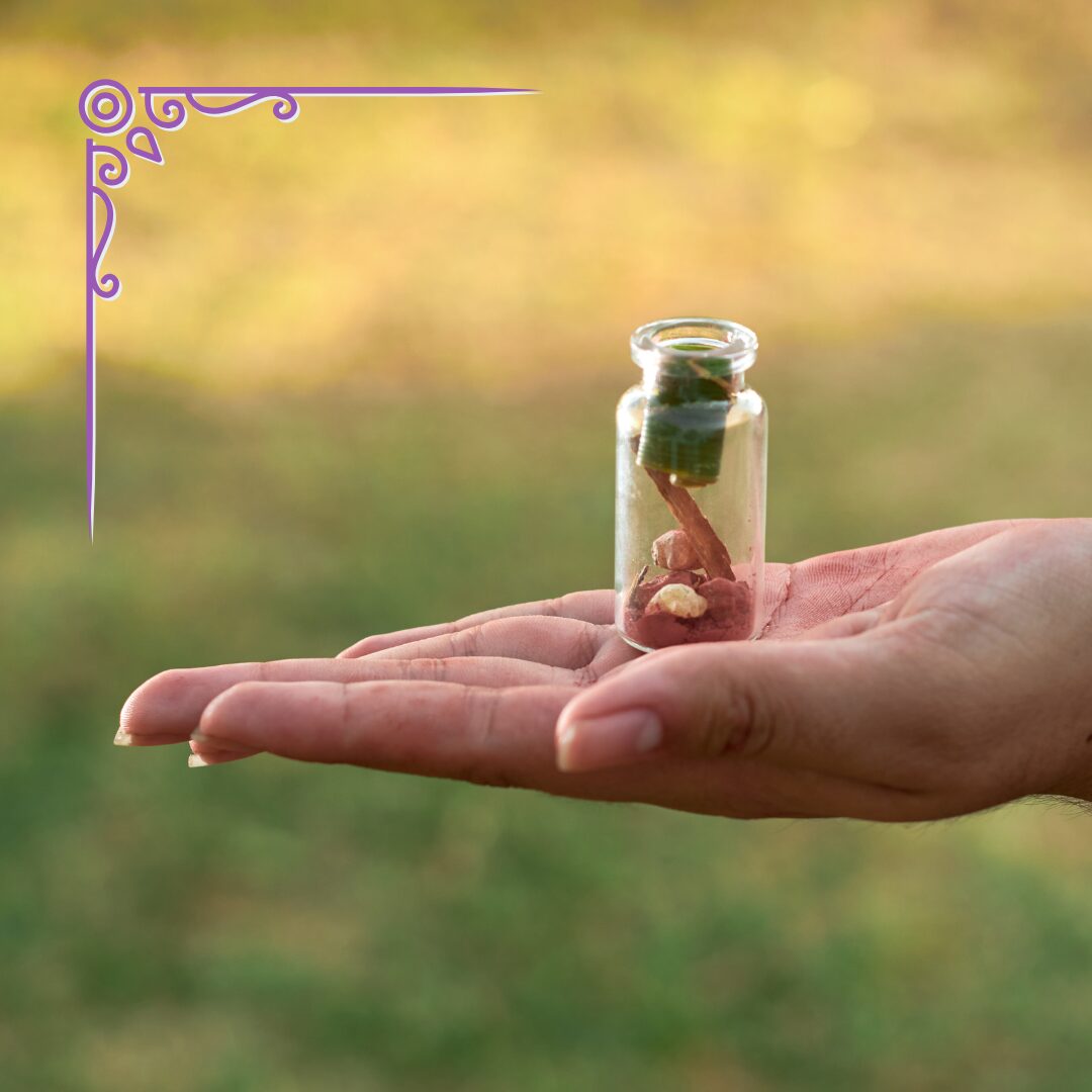 a hand holds a small jar containing spell materials