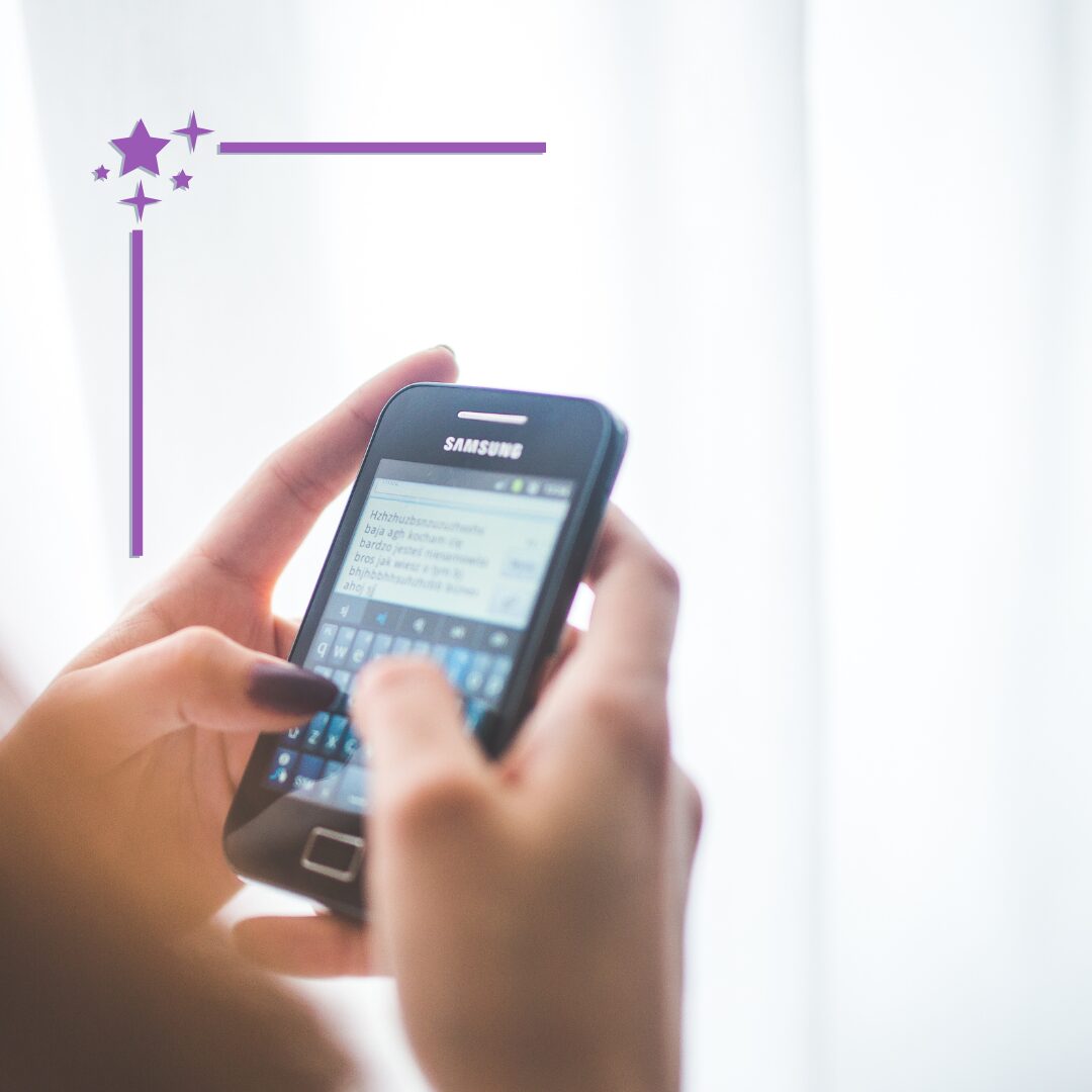 two hands typing on a samsung smart phone