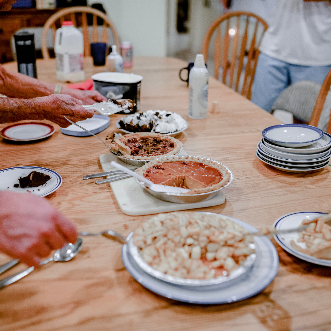 a family dining table set with a dessert selection