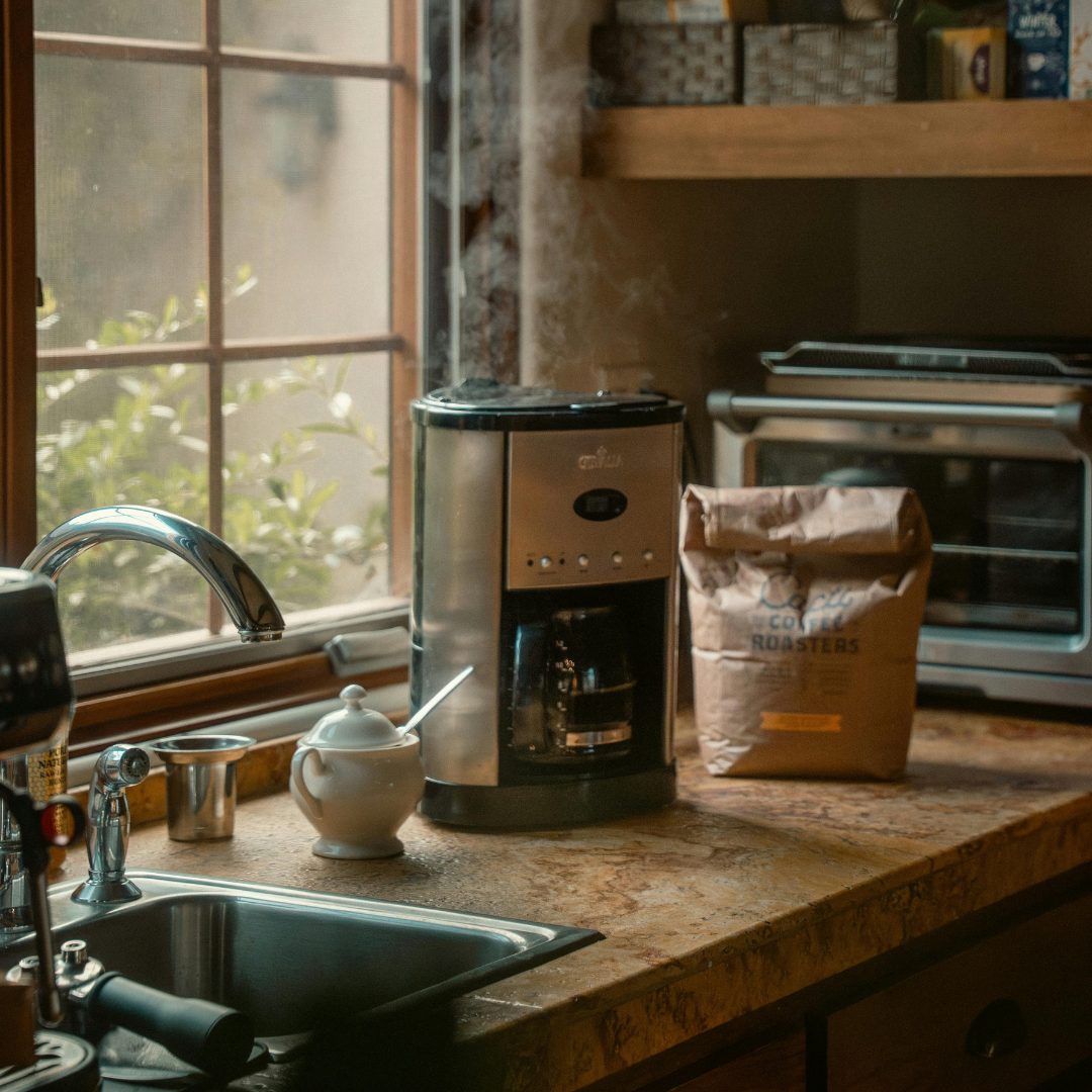 a coffee machine perking on a kitchen counter
