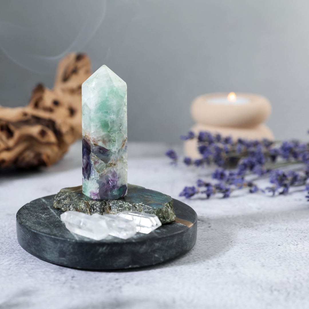 a fluorite point with clear quartz points and lavender